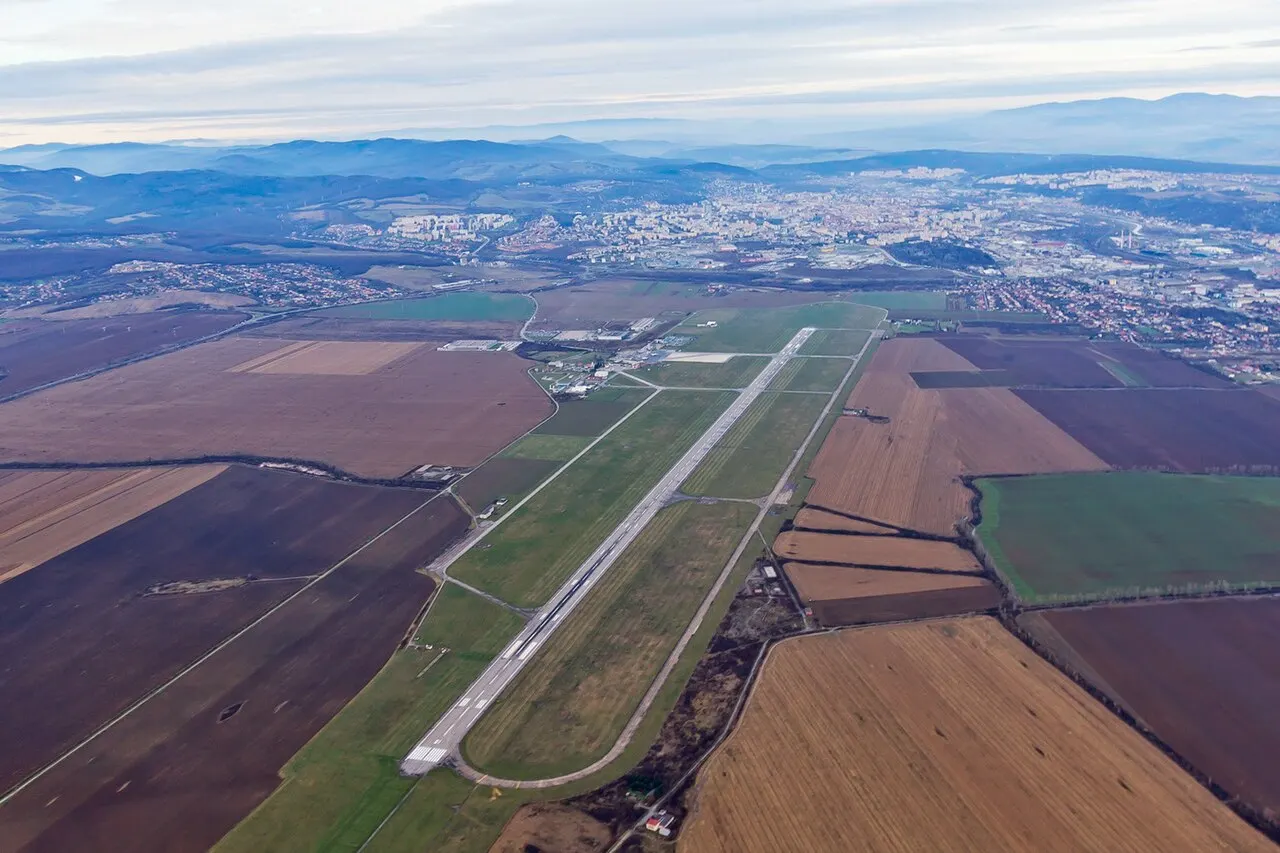 The airport from the air, with the city in the background