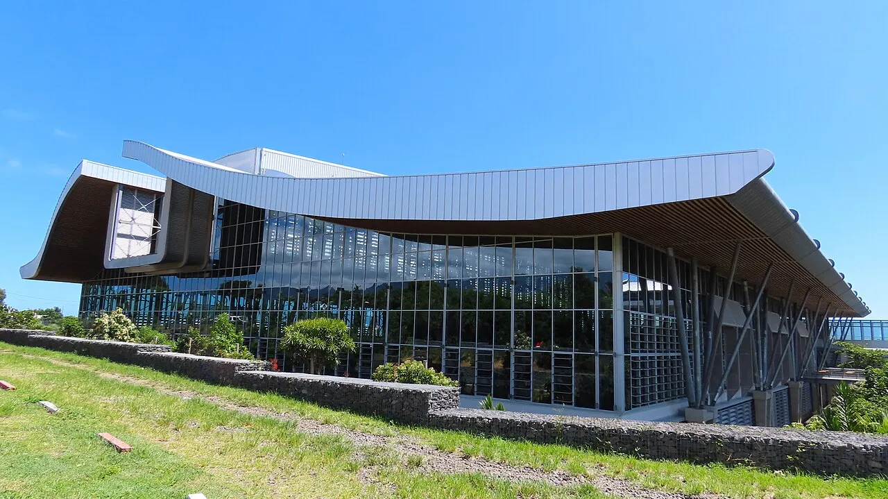 The new arrivals terminal building with its wave-shaped roof