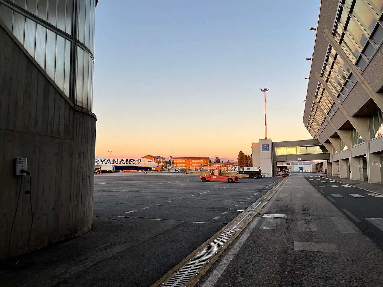 The apron at dusk, beside the terminal