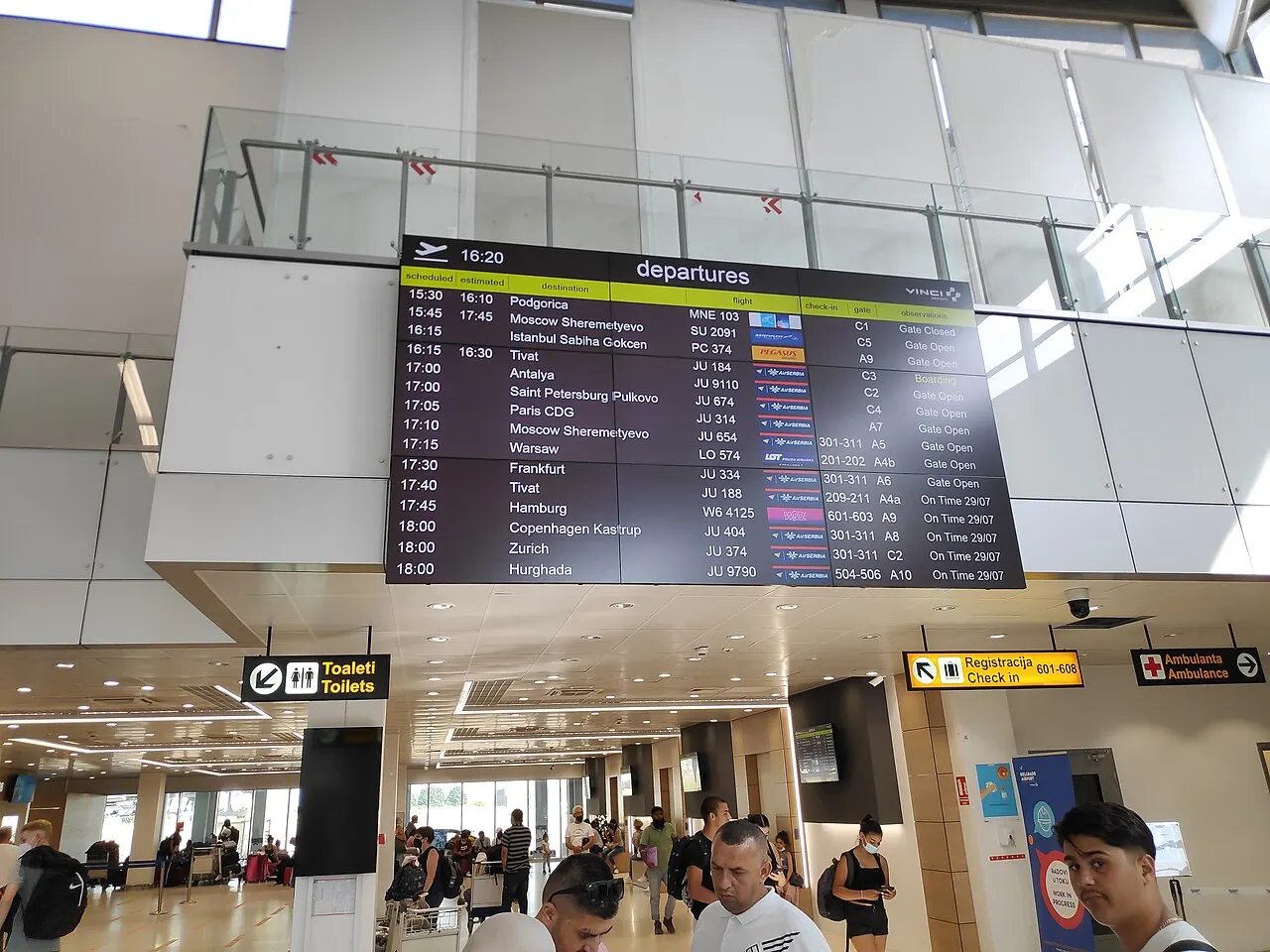 The departures hall with the flight board