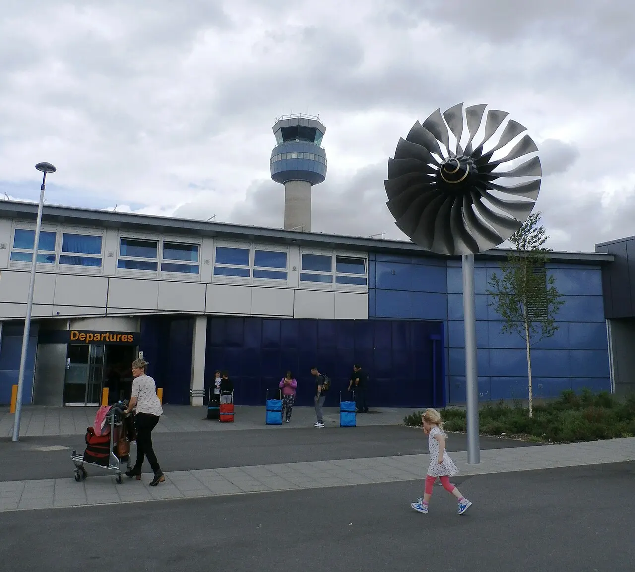 The departures area of the terminal, with the control tower behind