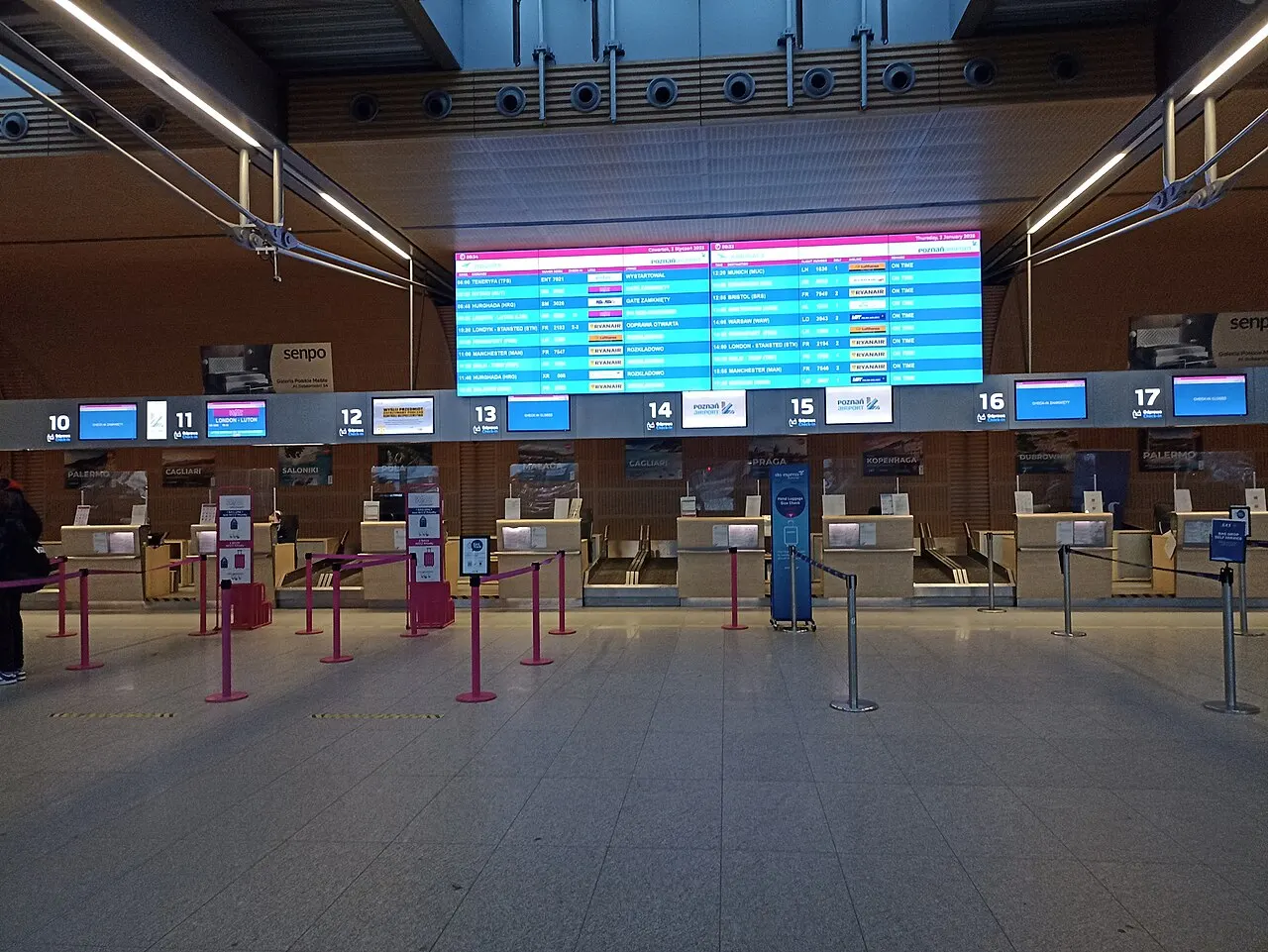 The check-in desks and the flight board