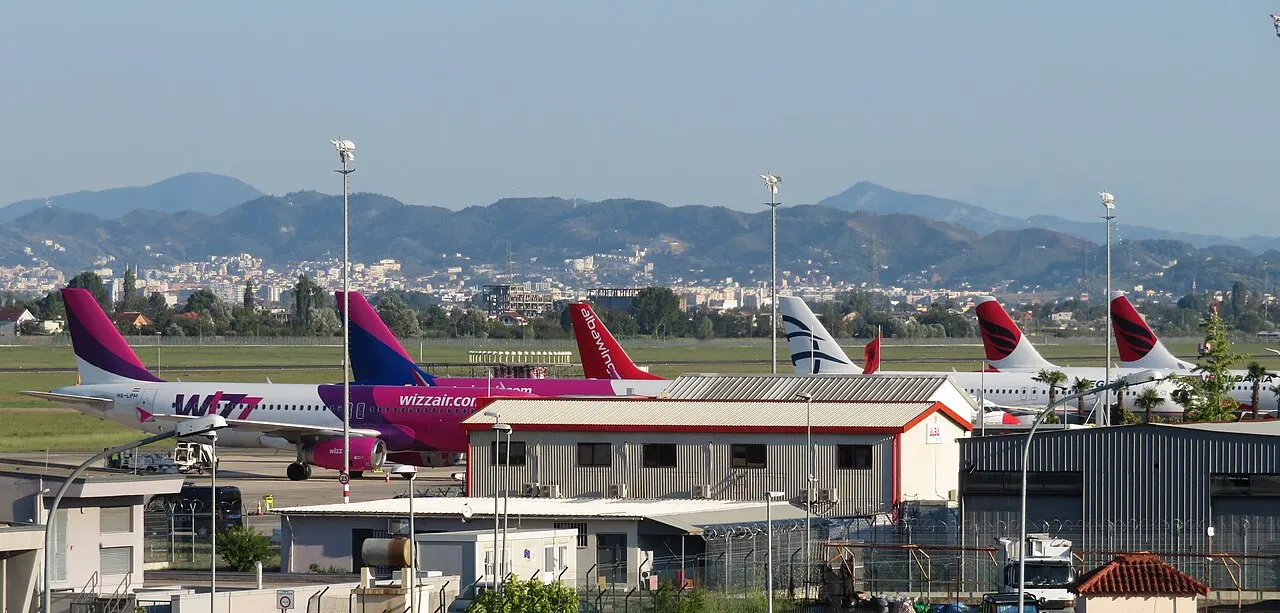 Planes at the airport, with the mountains behind